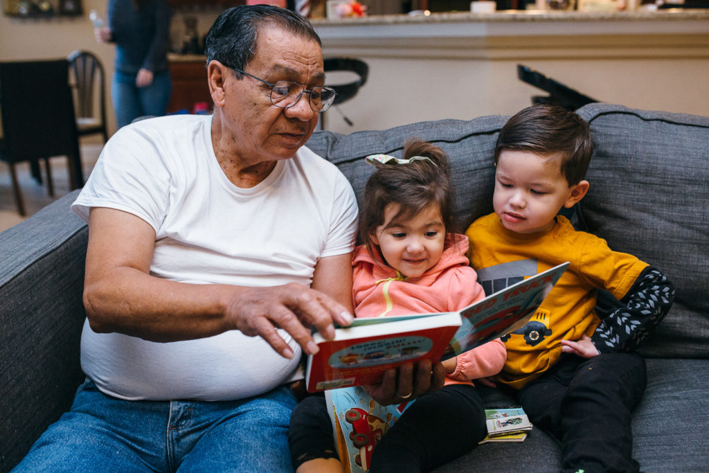 great grandpa reading to little kids