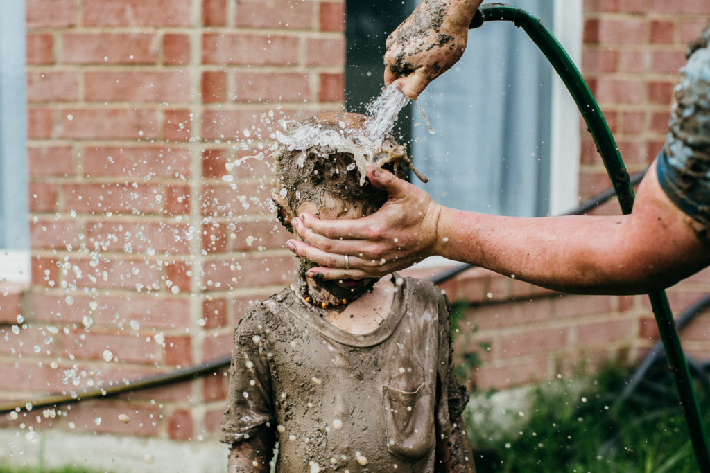 cleaning up after mud fight