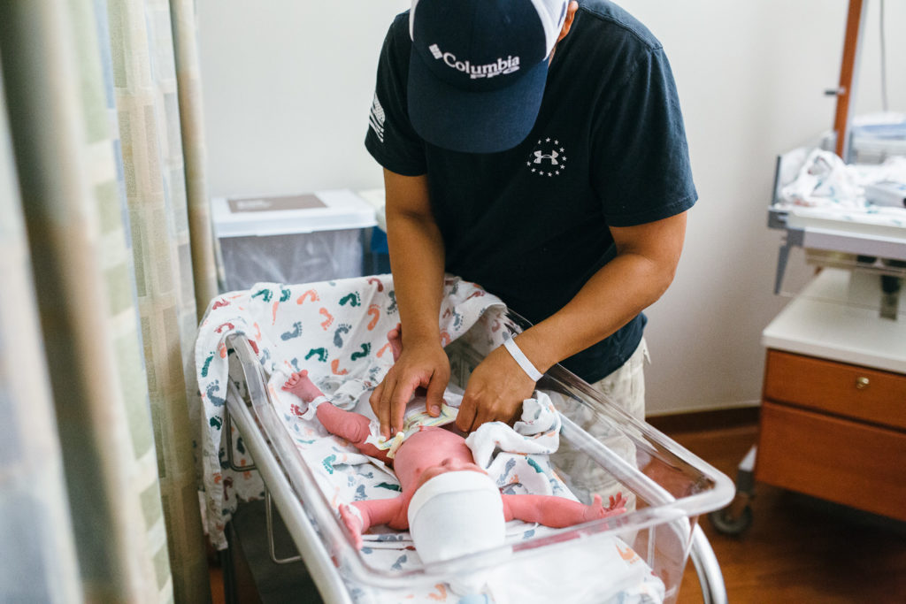 dad in hospital with newborn