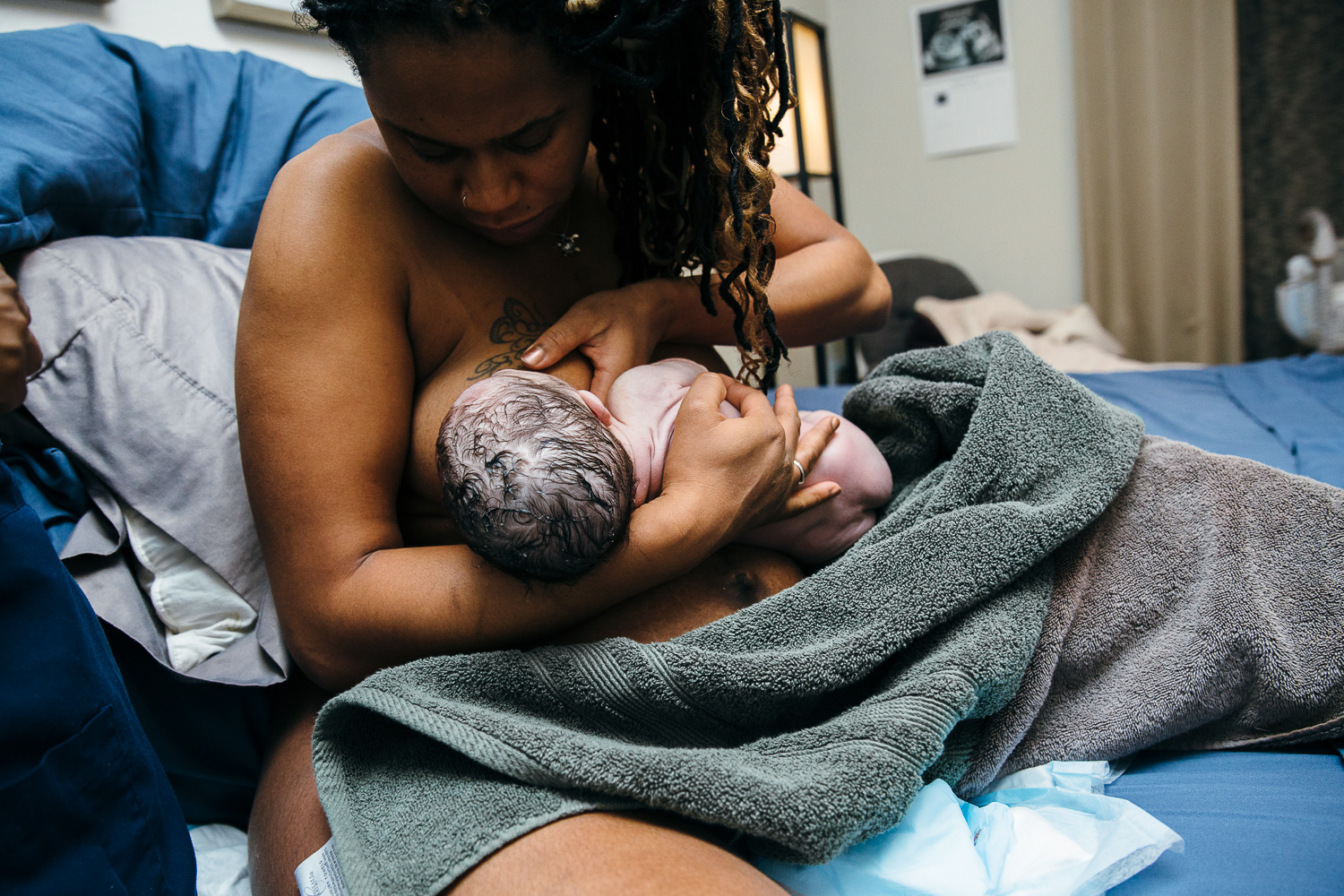 woman of color breastfeeding image