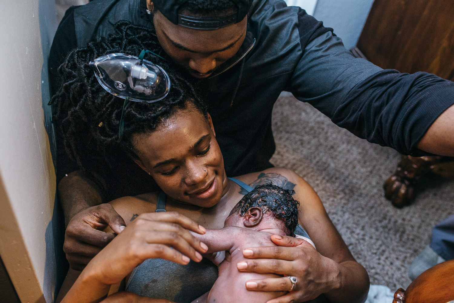 holding newborn after birth
