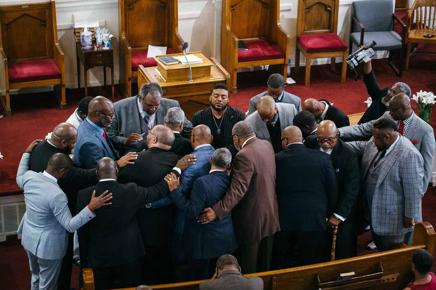 group prayer at church service