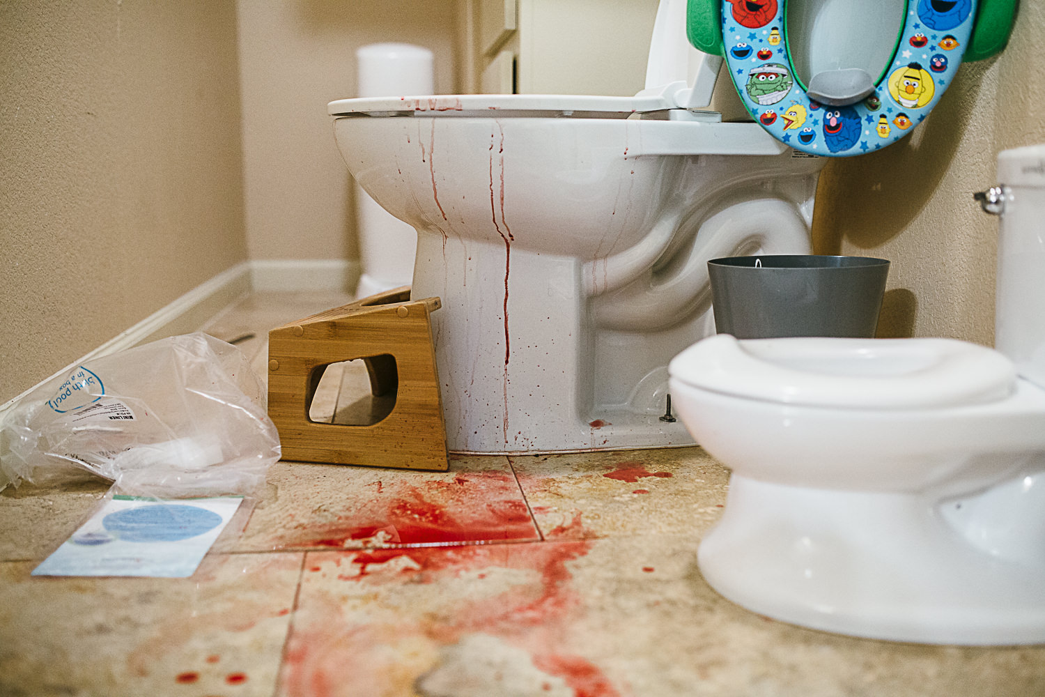 blood on the floor and toilet after an unassisted birth