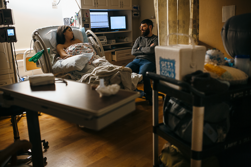 dallas birth photography captures two parents in the hospital waiting to go home after birth